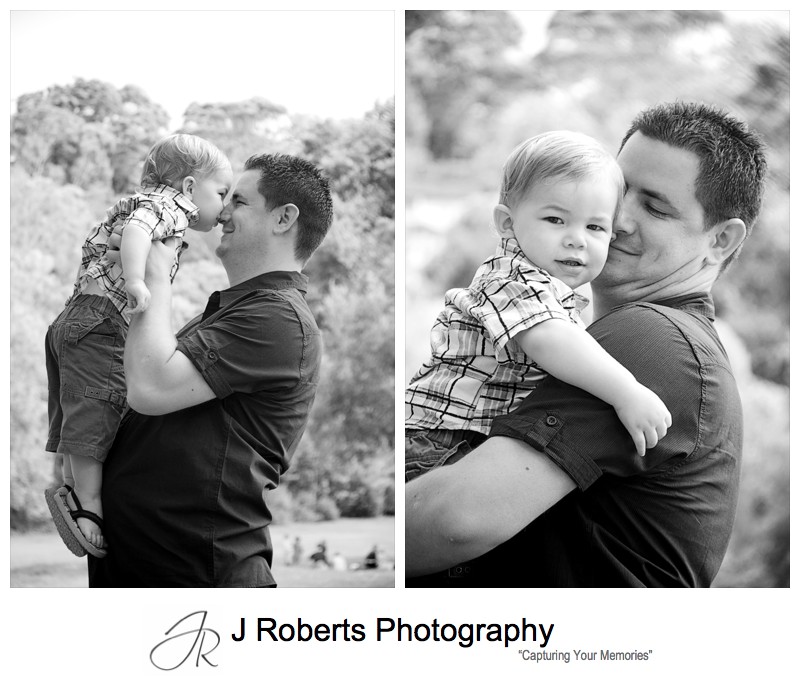 Little boy having cuddles with his dad - family portrait photography sydney
